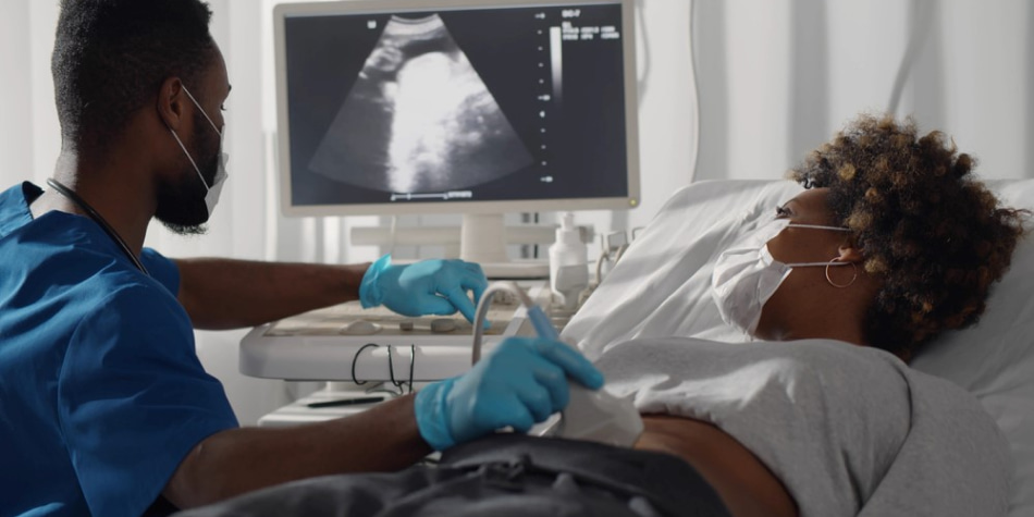 A pregnant woman watches the ultrasound screen as her OB performs an
abdominal ultrasound.